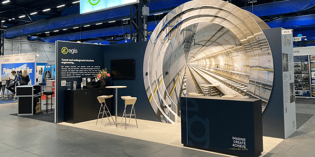 Exhibition stands with tunnel motifs and information about tunnel and underground construction during the World Tunnel Congress 2025 at Stockholmsmässan.