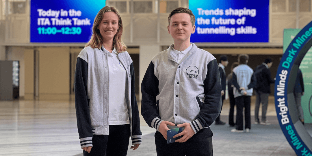 Two student hosts from local universities in Stockholm during the World Tunnel Congress 2025 at Stockholmsmässan.